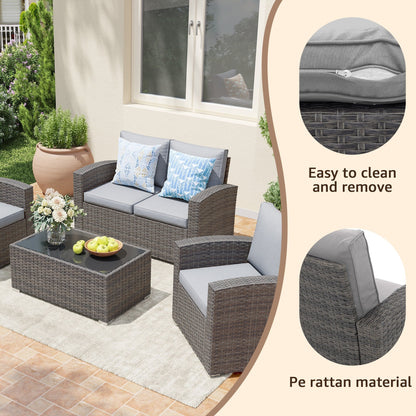 Set da conversazione in rattan per 4 persone con cuscini grigi e tavolo da esterno in vetro temperato