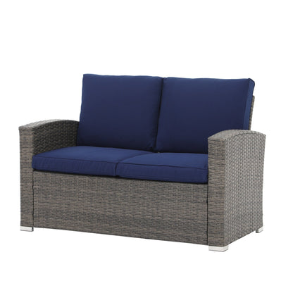 Set da conversazione in rattan per 4 persone con cuscini grigi e tavolo da esterno in vetro temperato