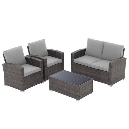 Set da conversazione in rattan per 4 persone con cuscini grigi e tavolo da esterno in vetro temperato