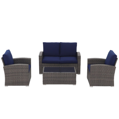 Set da conversazione in rattan per 4 persone con cuscini grigi e tavolo da esterno in vetro temperato