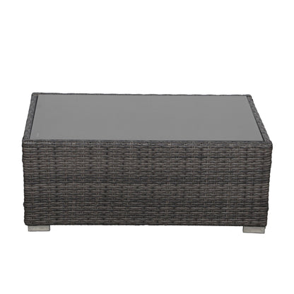 Set da conversazione in rattan per 4 persone con cuscini grigi e tavolo da esterno in vetro temperato