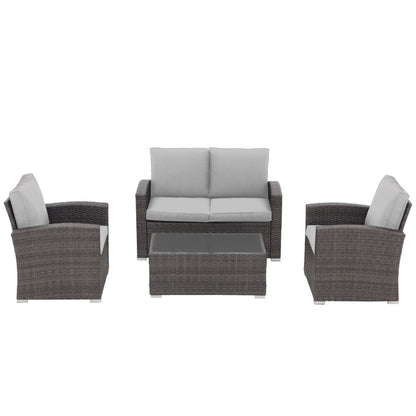 Set da conversazione in rattan per 4 persone con cuscini grigi e tavolo da esterno in vetro temperato