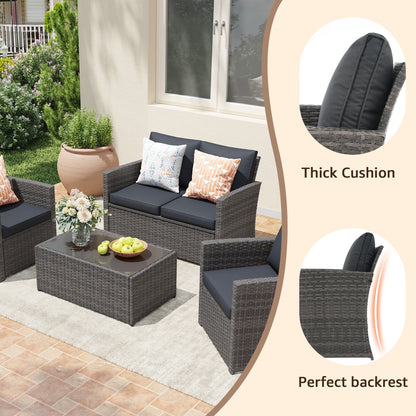 Set da conversazione in rattan per 4 persone con cuscini grigi e tavolo da esterno in vetro temperato