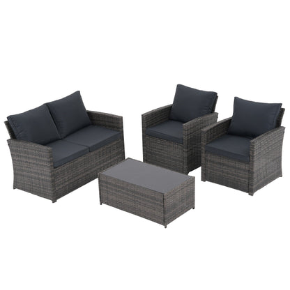 Set da conversazione in rattan per 4 persone con cuscini grigi e tavolo da esterno in vetro temperato