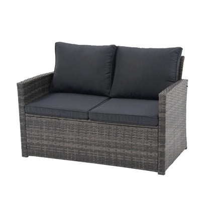 Set da conversazione in rattan per 4 persone con cuscini grigi e tavolo da esterno in vetro temperato