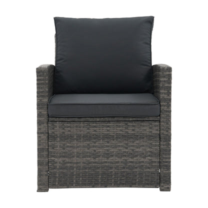 Set da conversazione in rattan per 4 persone con cuscini grigi e tavolo da esterno in vetro temperato