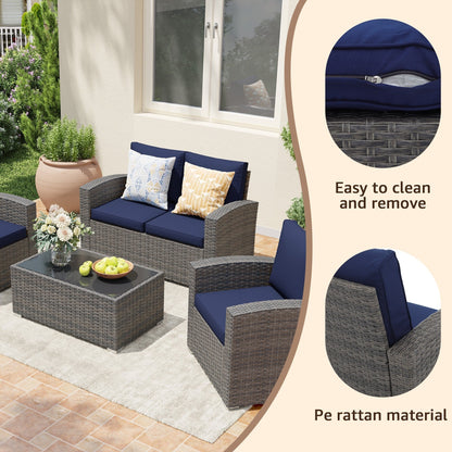 Set da conversazione in rattan per 4 persone con cuscini grigi e tavolo da esterno in vetro temperato