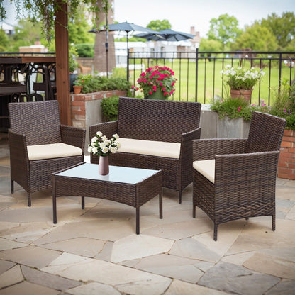 Set di mobili da esterno da 4 pezzi con cuscini, set da conversazione in vimini e tavolino da caffè in vetro