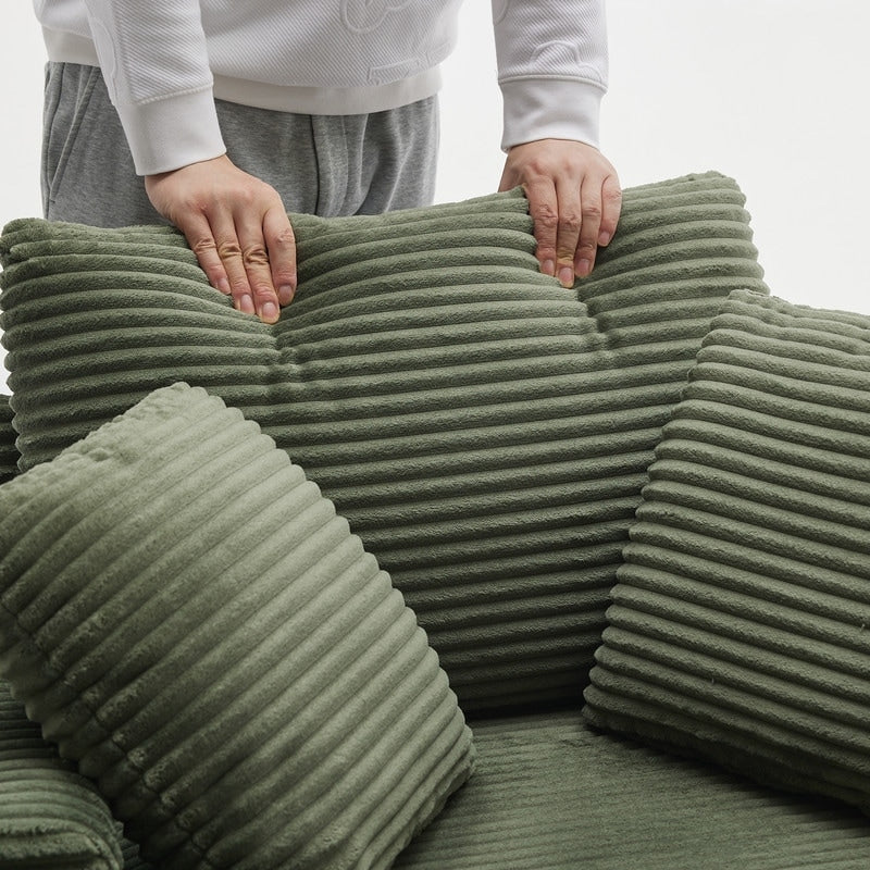 42.12 Divano imbottito in velluto a coste + pouf