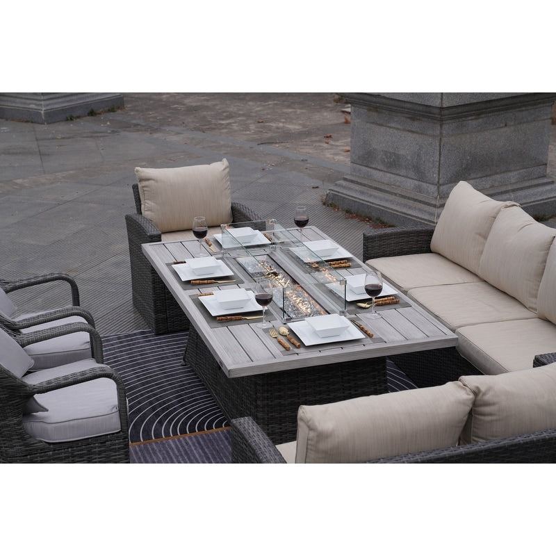 Set di divani da giardino in rattan da 7 pezzi con tavolo da pranzo in alluminio e poltrone