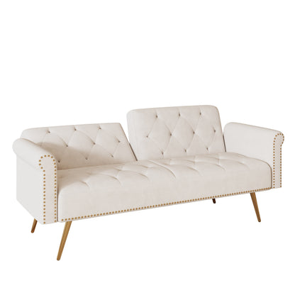 Un divano letto lungo 69,7 pollici rivestito in tessuto di velluto beige, con finiture a borchie e accompagnato da un cuscino coordinato.
