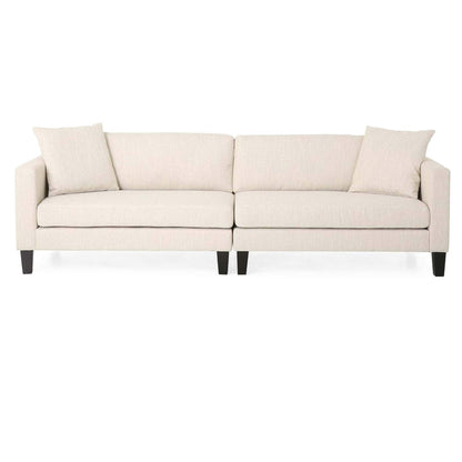 Divano beige a 3 posti con gambe in legno e due cuscini