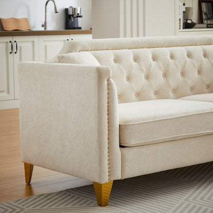 Divano capitonné a 3 posti in ciniglia beige con decorazione a chiodi in rame