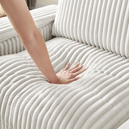 Divano a due posti in tessuto beige con bracciolo contenitore e USB