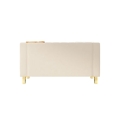 Divano moderno in velluto beige con dettagli dorati e cuscini morbidi per il soggiorno