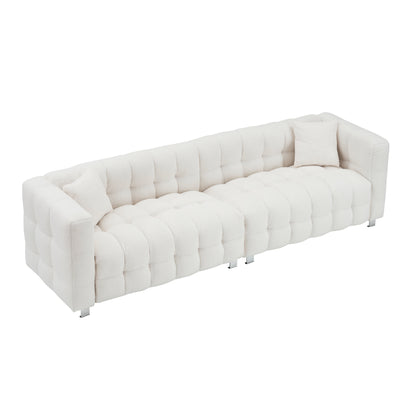 Divano Teddy beige a 4 posti con due cuscini decorativi