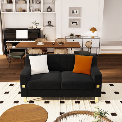 Divano a due posti moderno in velluto nero con dettagli dorati e cuscini morbidi per il soggiorno