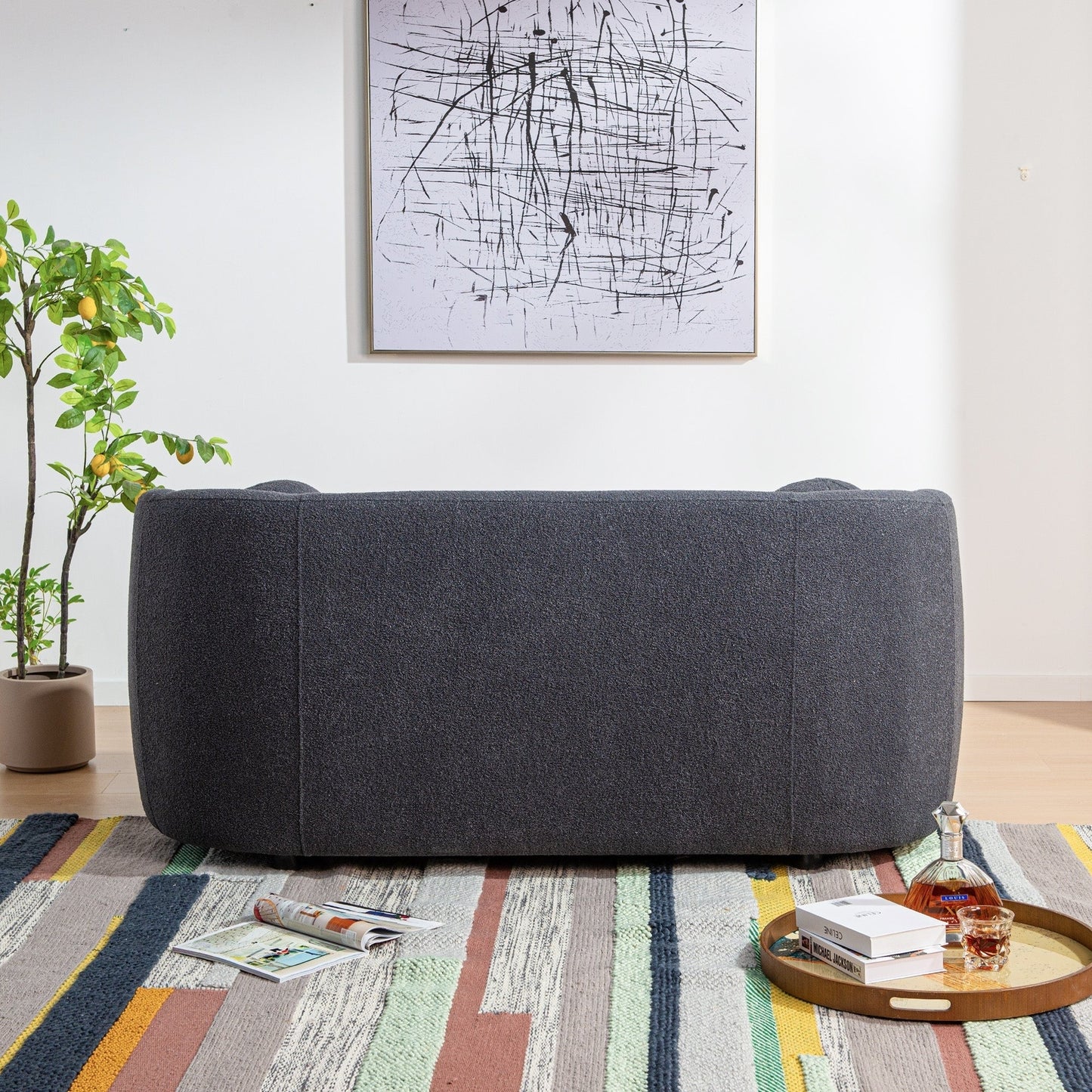 Divano a due posti imbottito in tessuto Boucle KINWELL con cuscini