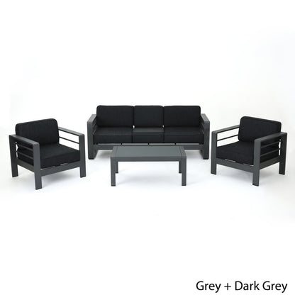 Set di divani da esterno Cape Coral in alluminio temperato e vetro, 4 pezzi, con cuscini, di Christopher Knight Home