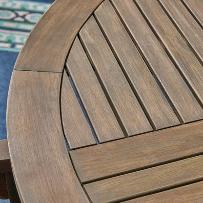 Set da pranzo rotondo in acacia da 4 posti Casa Outdoor con gambe intagliate di Christopher Knight Home