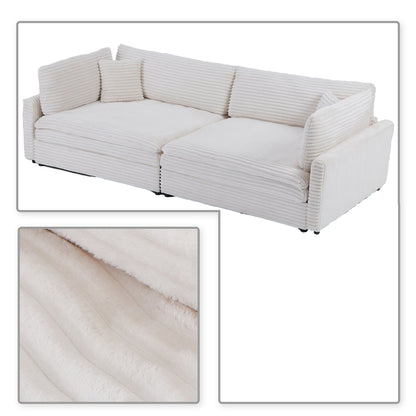 Divano classico ed elegante a tre posti rivestito in velluto a coste con due cuscini decorativi