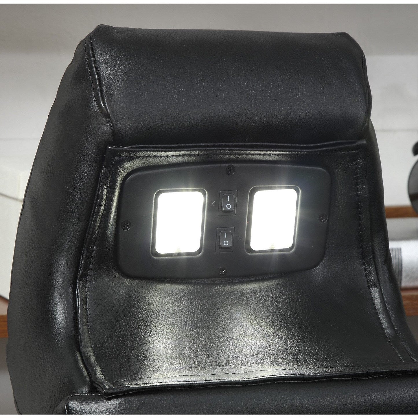 Divano elettrico Delange in similpelle nera con poggiatesta