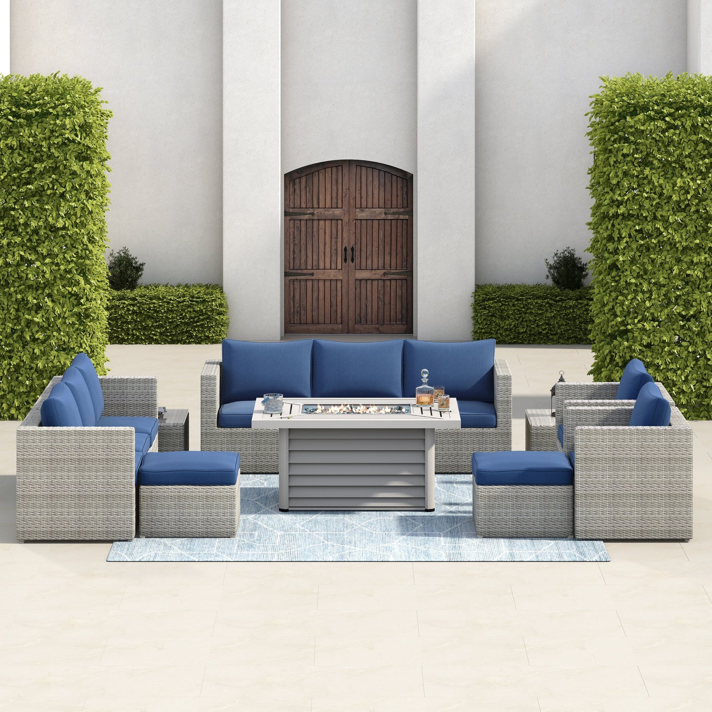 Set di mobili da giardino componibili in vimini intrecciato Corvus Trey da 13 pezzi con tavolo da fuoco