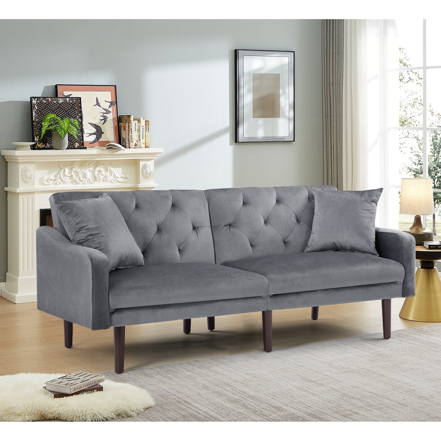 Divano letto a 3 posti in velluto grigio scuro con cuscini decorativi e struttura in legno