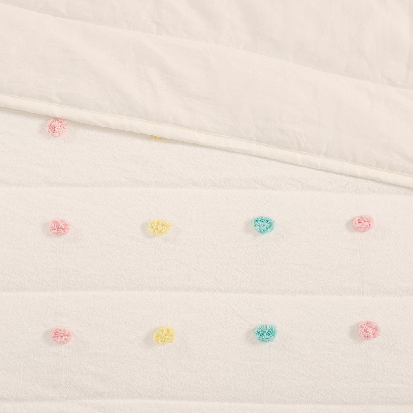 Set trapunta in cotone jacquard con pompon Ensley di Intelligent Design Kids e cuscini