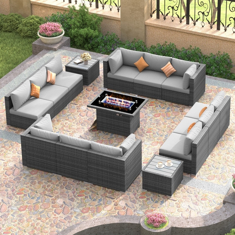 Set di divani componibili per esterni FINCATI in vimini grigio con tavolo e braciere