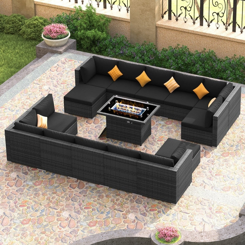 Set di divani componibili per esterni FINCATI in vimini grigio con tavolo e braciere