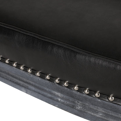 Divano a due posti in similpelle con gambe tornite e borchie