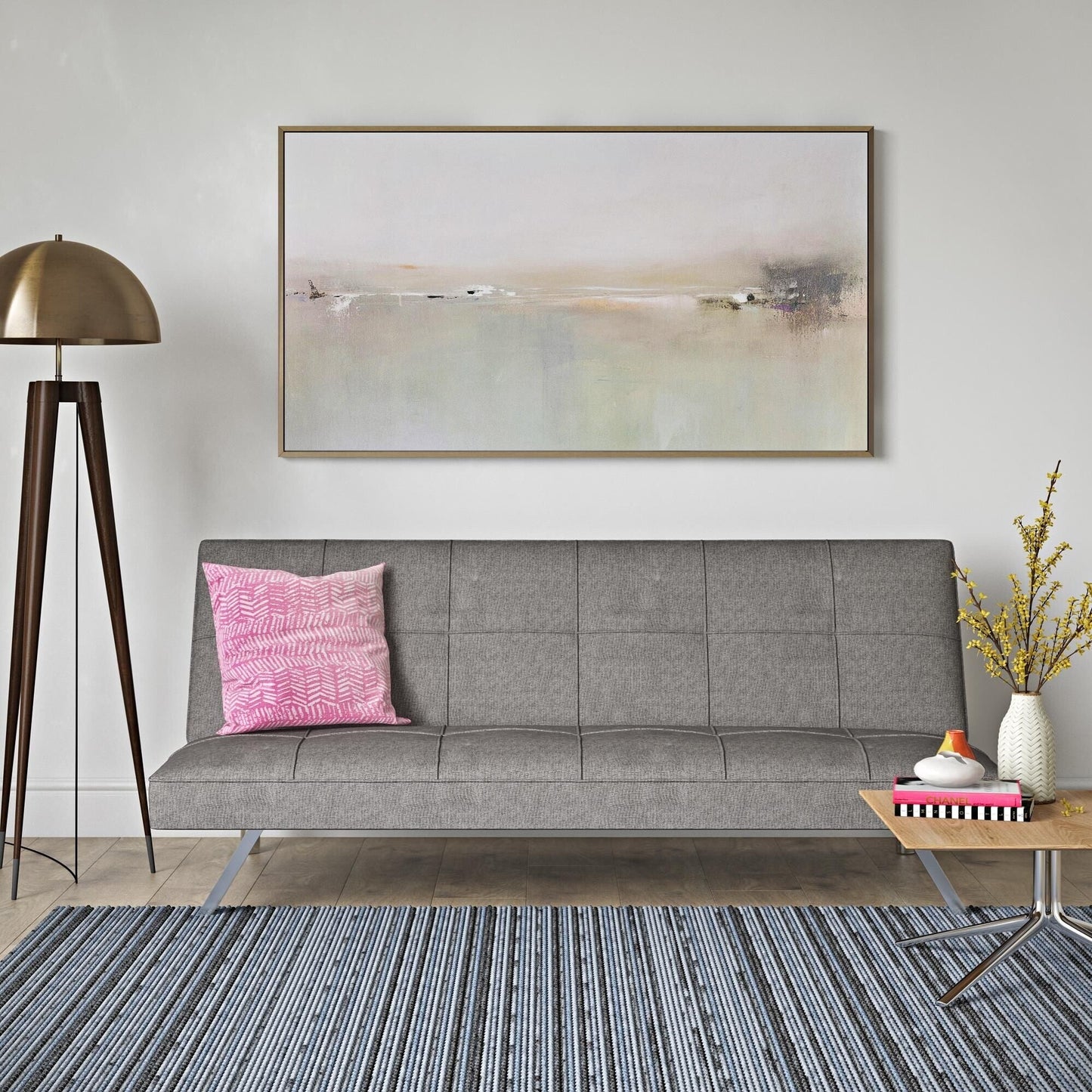 Divano letto in tessuto grigio con struttura in metallo