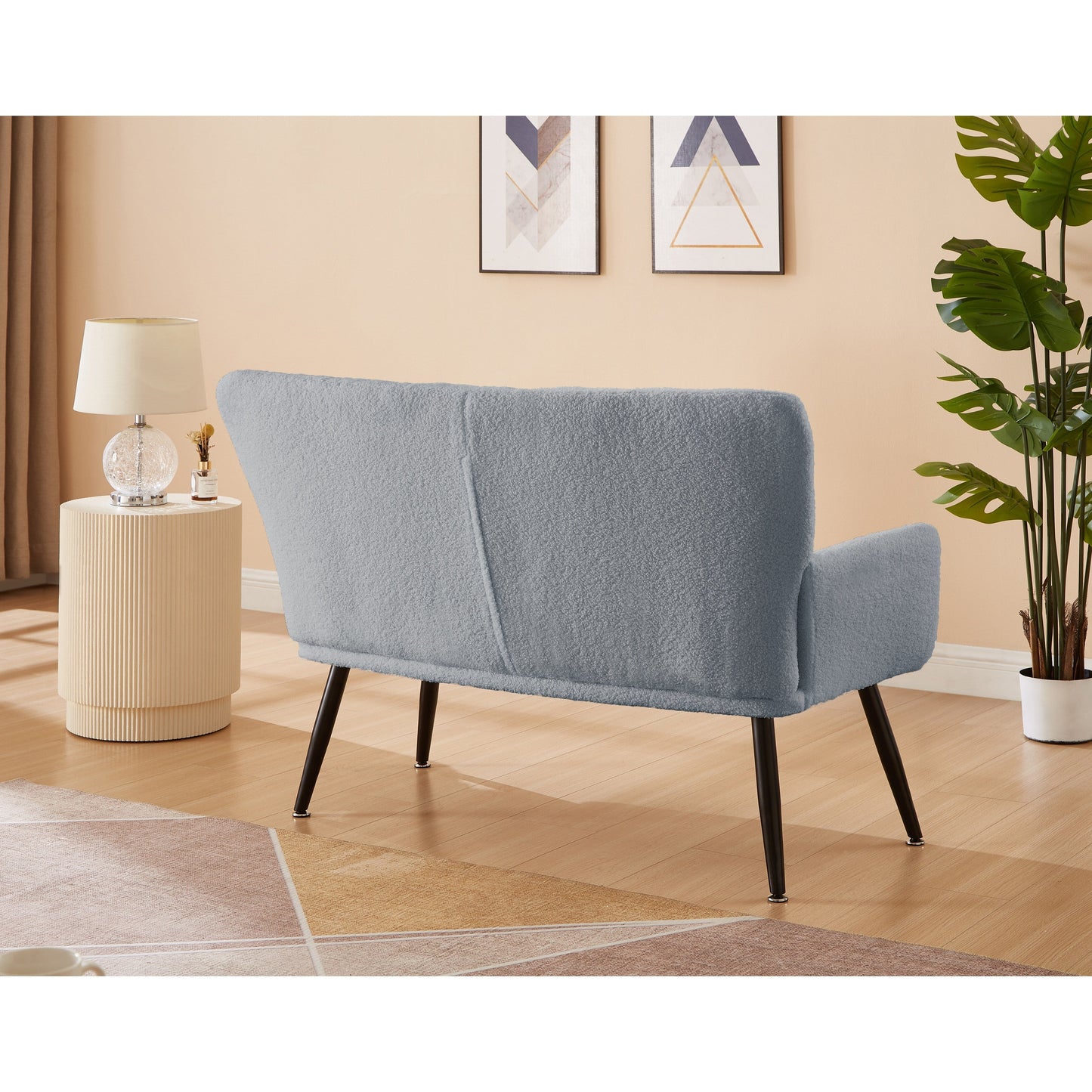 Divano a due posti Teddy azzurro 52 con schienali trapuntati e struttura in legno massello per il soggiorno.