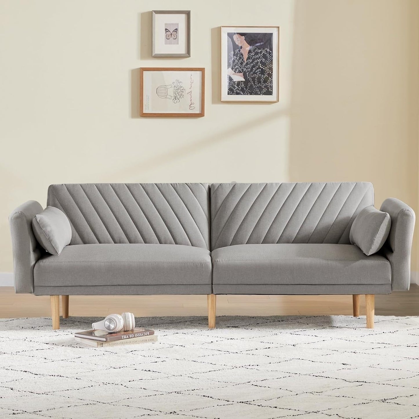 Divano letto trasformabile in futon con cuscini