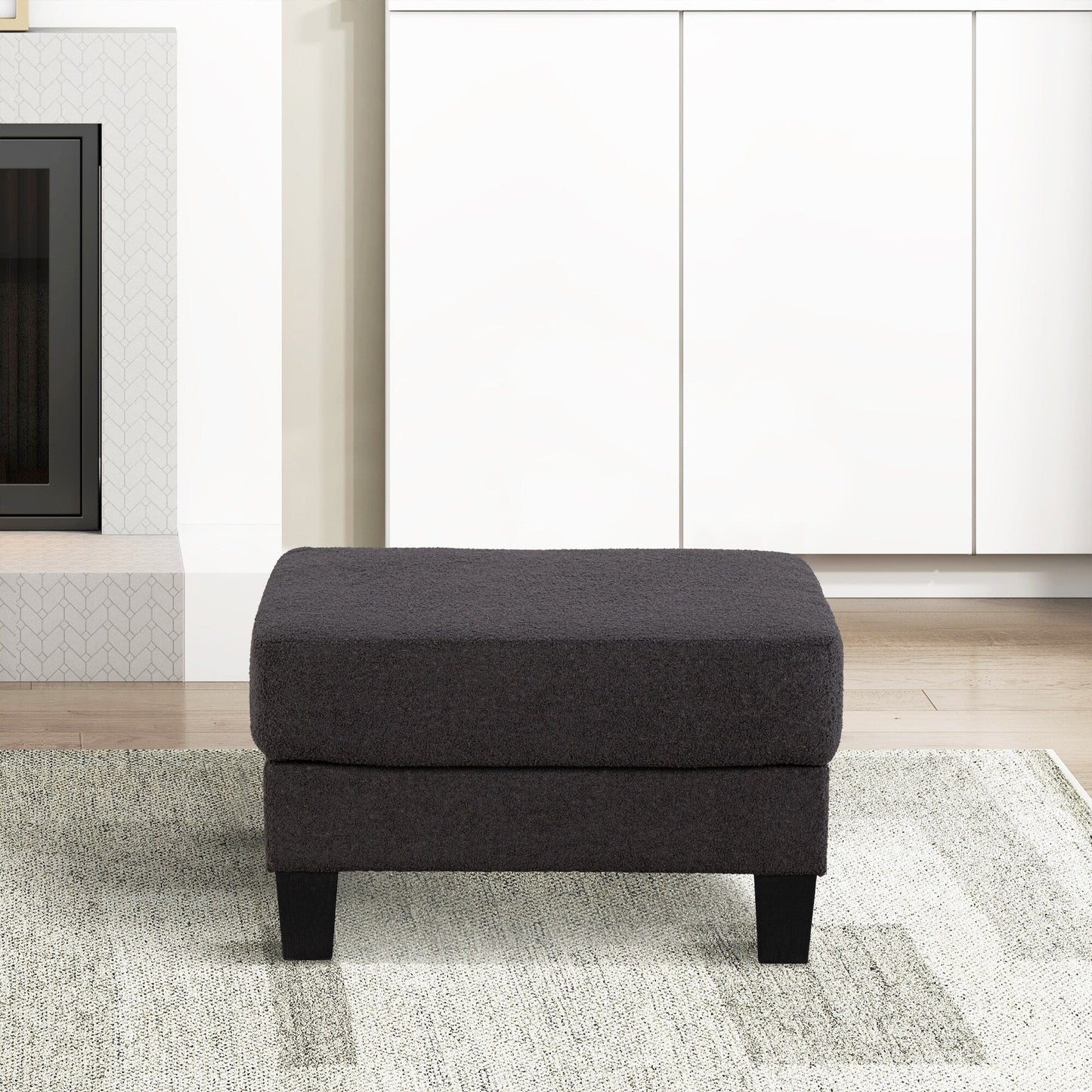 Pouf moderno in tessuto nero con funzione di contenimento