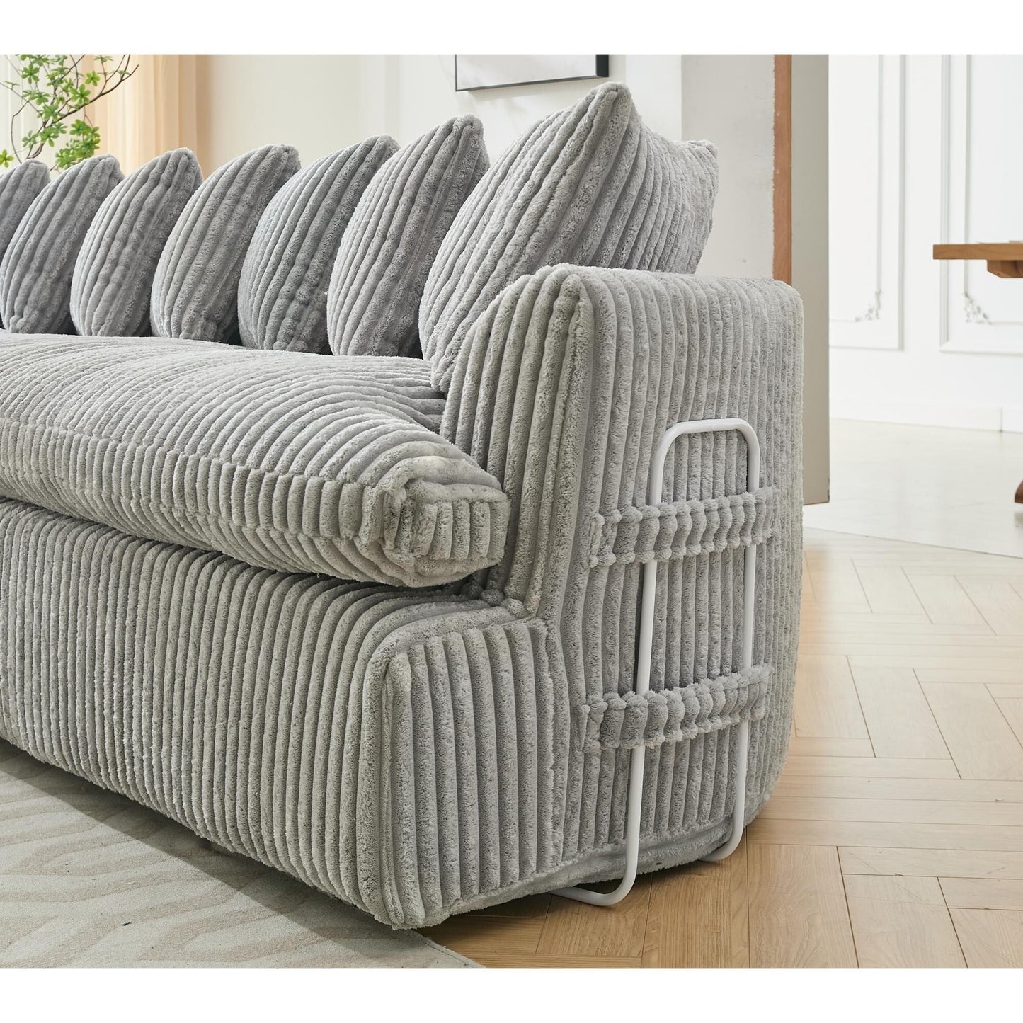 Divano componibile modulare moderno a 4 posti in velluto a coste a forma di L con design curvo e cuscini per lo schienale per il soggiorno