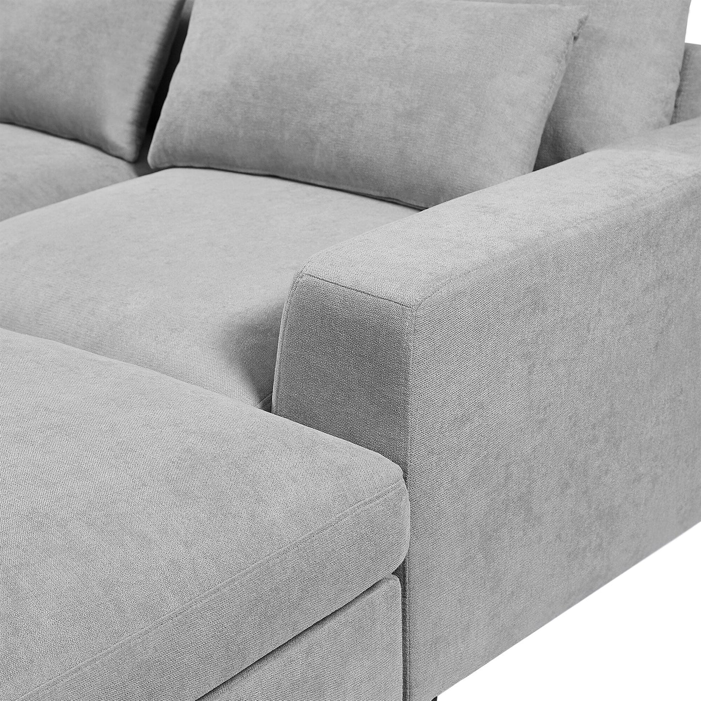 Divano componibile moderno a forma di L imbottito in piume con chaise longue reversibile e cuscini per soggiorno