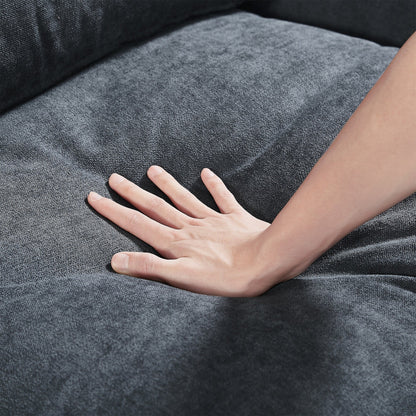 Divano componibile moderno a forma di L imbottito in piume con chaise longue reversibile e cuscini per soggiorno