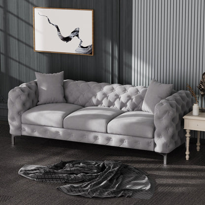 Divano moderno in velluto Morden Fort con bottoni trapuntati, struttura in legno massello e gambe in ferro