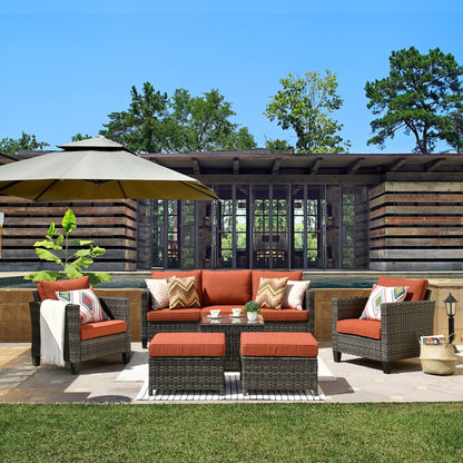 Set da conversazione in vimini per patio esterno OVIOS da 6 pezzi con tavolo con piano in vetro