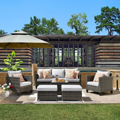 Set da conversazione in vimini per patio esterno OVIOS da 6 pezzi con tavolo con piano in vetro