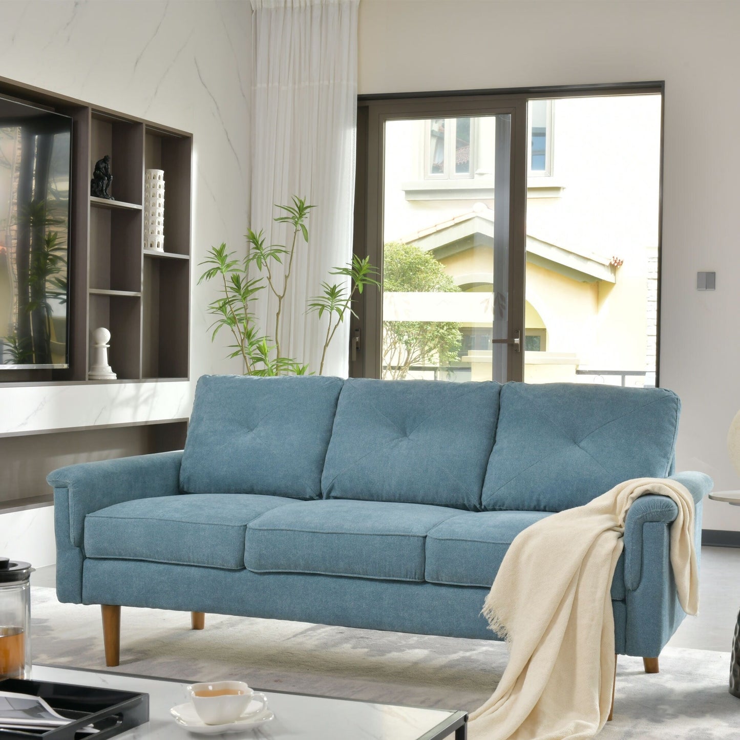 Divano da interno con gambe in legno e cuscino OVIOS Rive Design