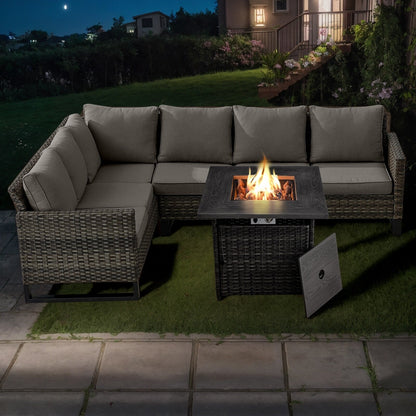 Divano componibile in vimini per esterni con tavolo con braciere
