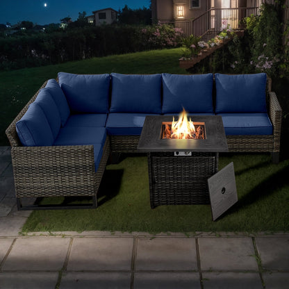 Divano componibile in vimini per esterni con tavolo con braciere