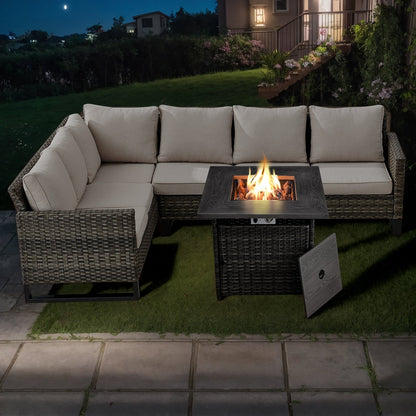 Divano componibile in vimini per esterni con tavolo con braciere