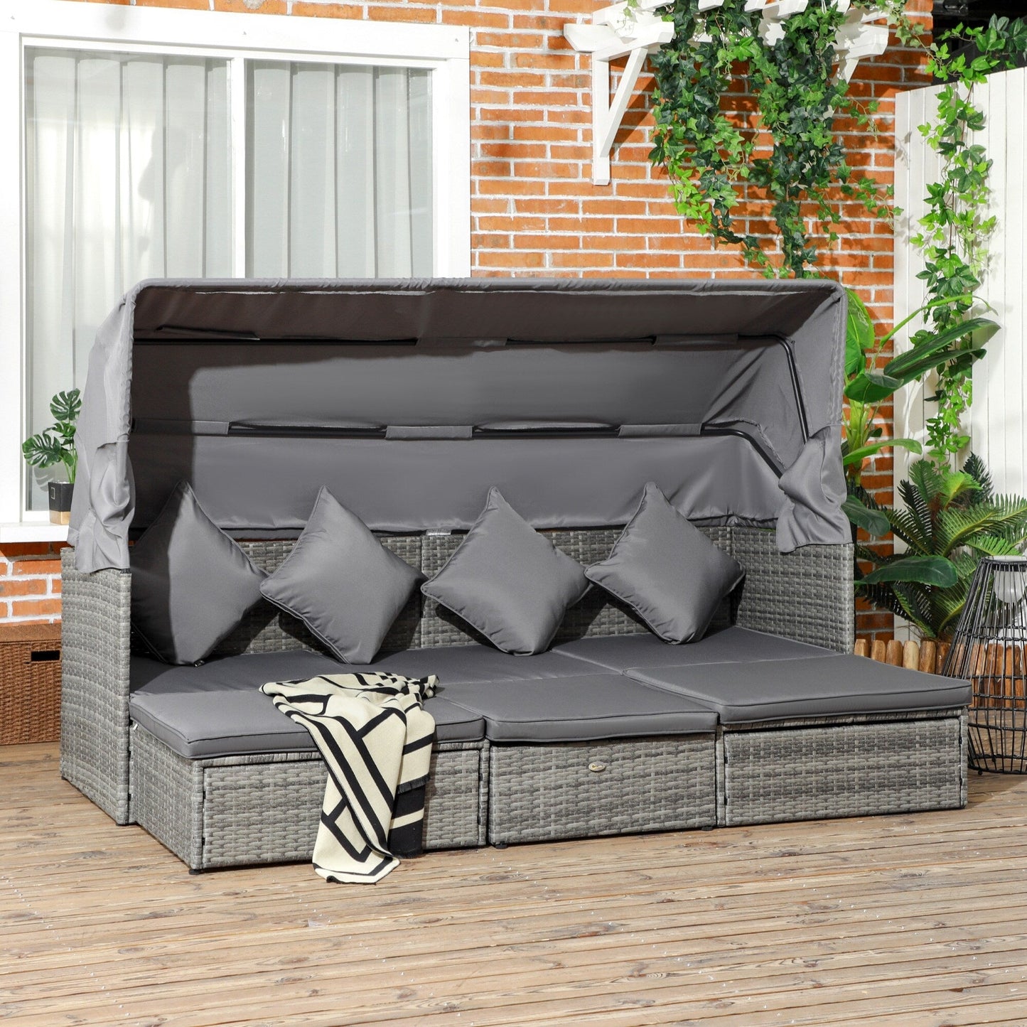 Set di mobili da giardino Outsunny da 4 pezzi con cuscini, divano letto in rattan PE con baldacchino retrattile, set di divani componibili per esterni