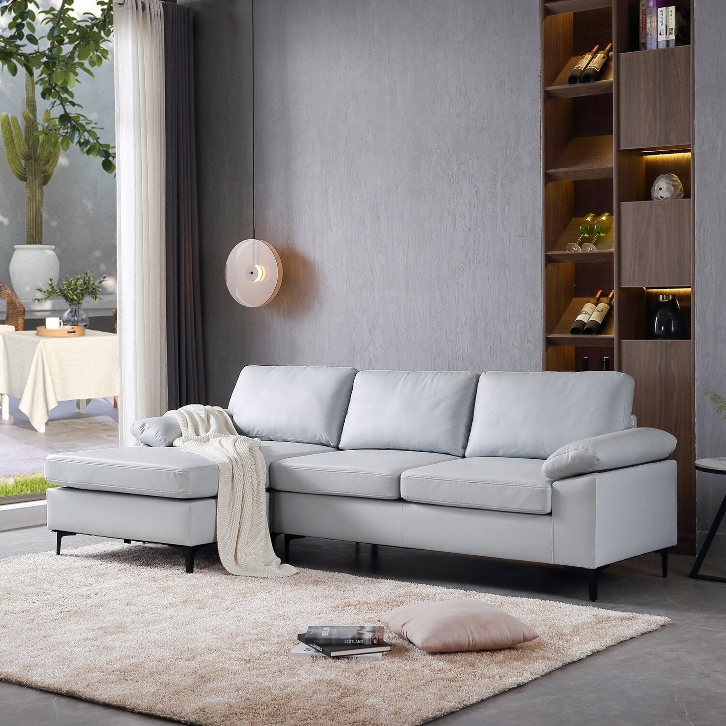 Divano chaise longue reversibile OVIOS con cuscini soffici e gambe in metallo