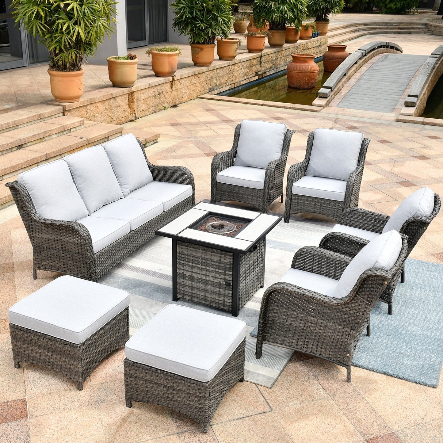 Set di mobili da giardino OVIOS in vimini grigio da 8 pezzi con braciere