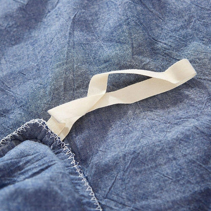 Set copripiumino reversibile in cotone con pompon